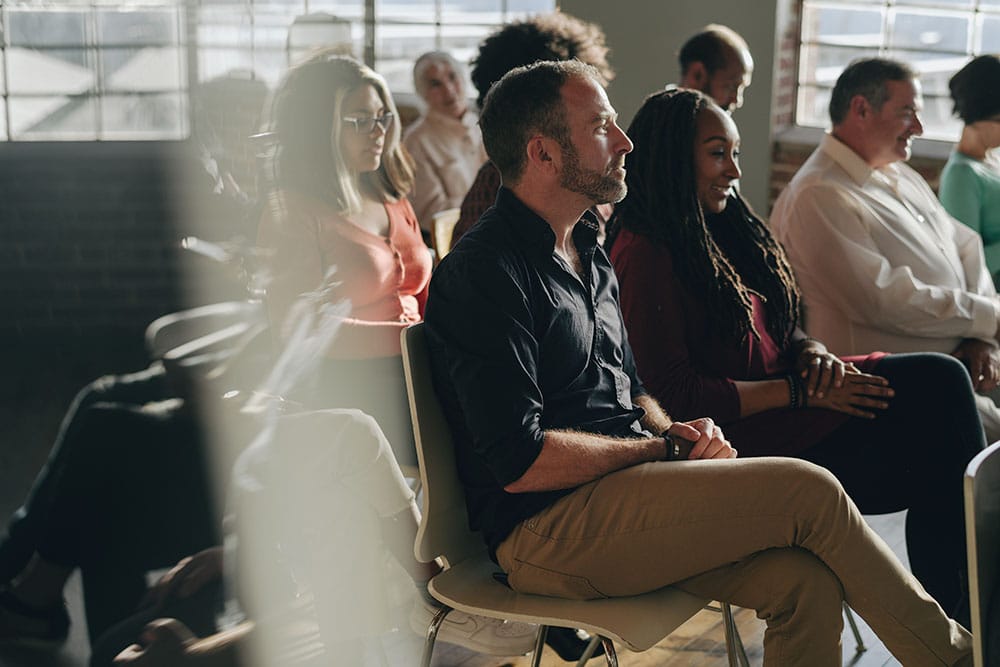 diverse people in a seminar with blur