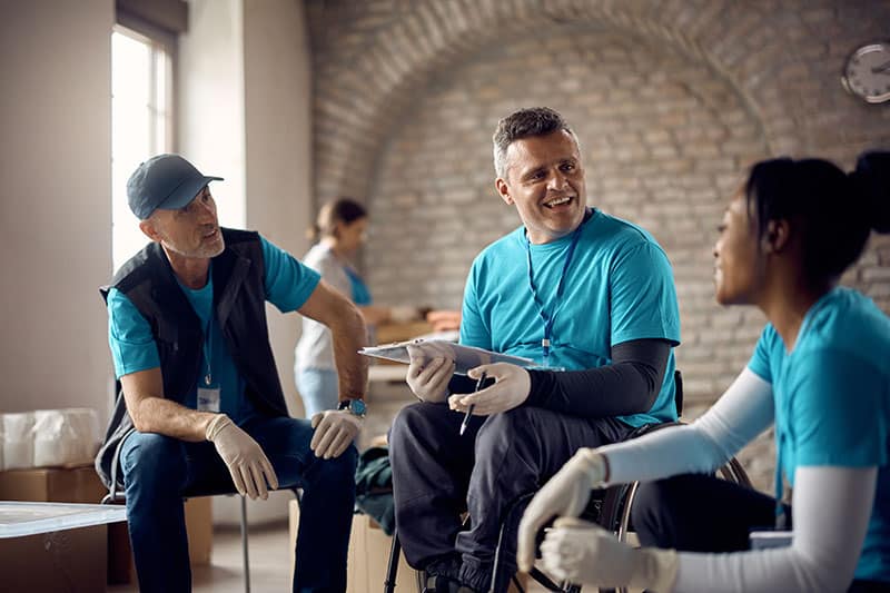 happy coordinator in wheelchair having a meeting